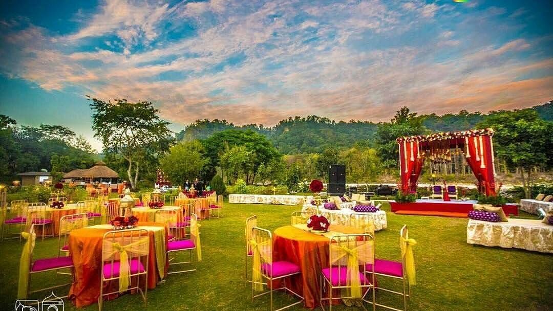 An image of an outdoor seating arrangement decorated with flowers