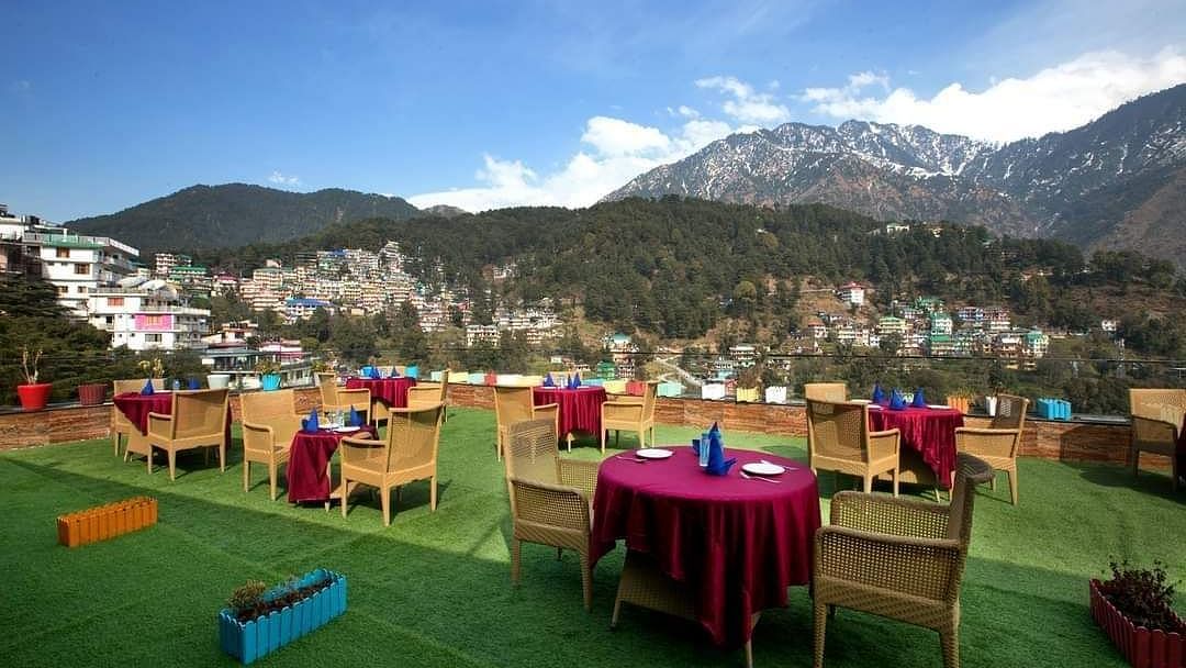image featuring an open dining space with beautiful views of the mountain - ZENQ SIGNATURE INN, MCLEODGANJ