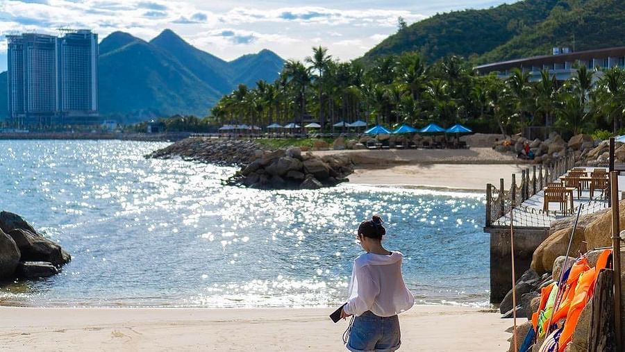 An image of a woman at the beach  - Alibu Resort Nha Thrang