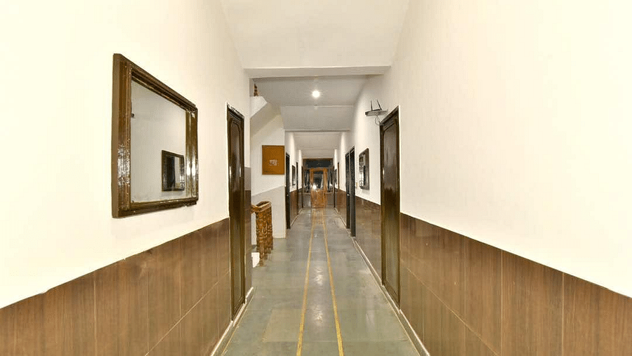 A well-lit corridor area of DLS Hotel Devlok, Manali
