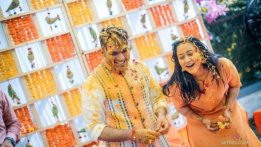 The couple drips in haldi during the Haldi celebrations - Rhythm Lonavala