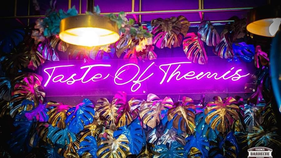 An image of a lit and decoarted dashboard where Taste of Themis is written