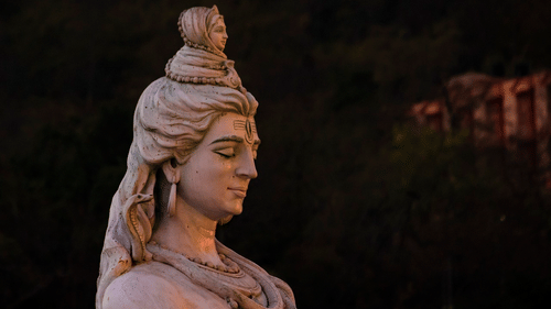 a statue of lord shiva with ganga rising from his hair