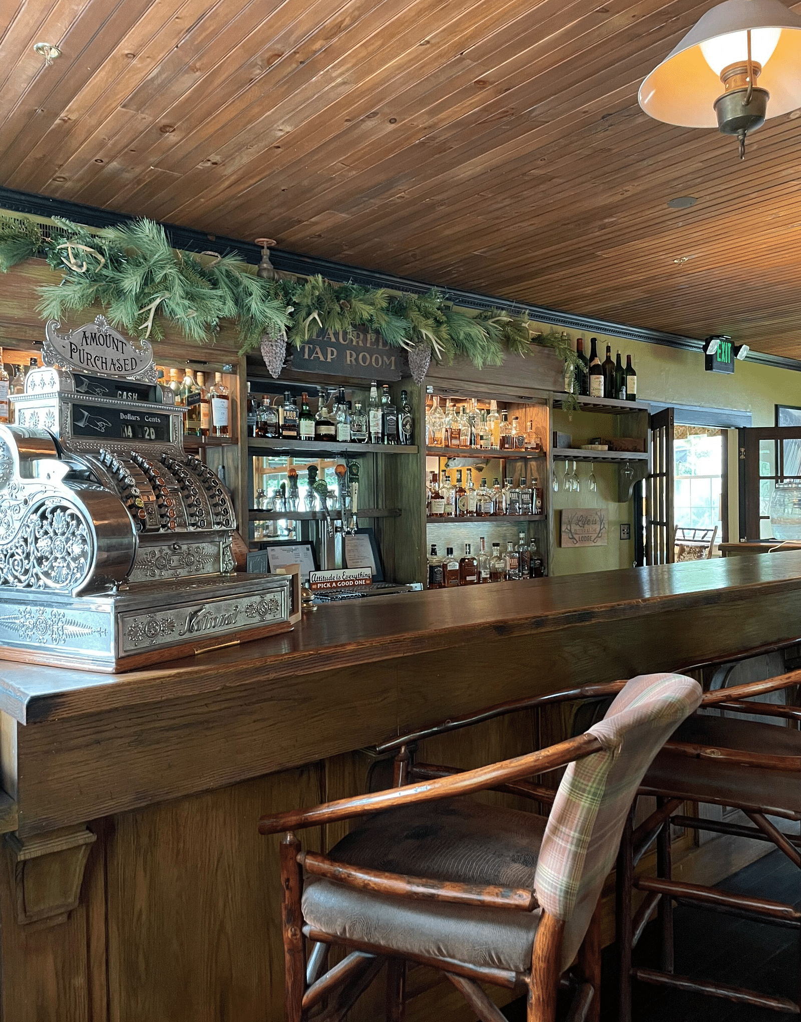 the Laurel Lounge with well staked inventory of beverages behind the bar counter - Historic Tapoco Lodge