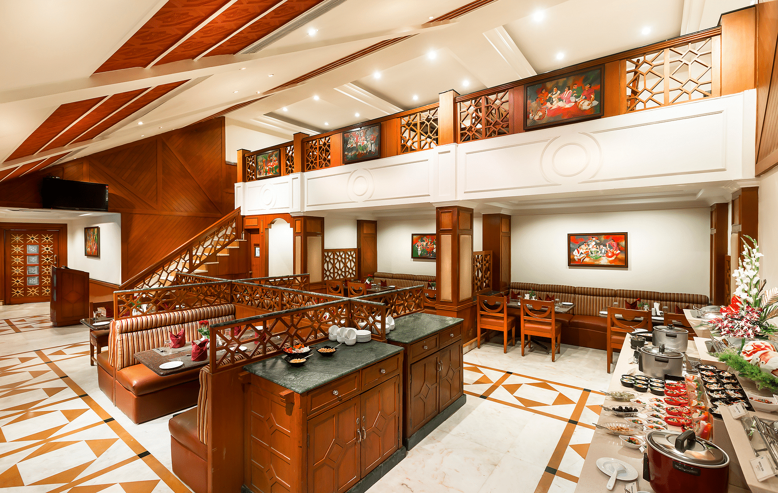 A seating arrangement of Dakshin Restaurant at Regency Kanchipuram by GRT Hotels.