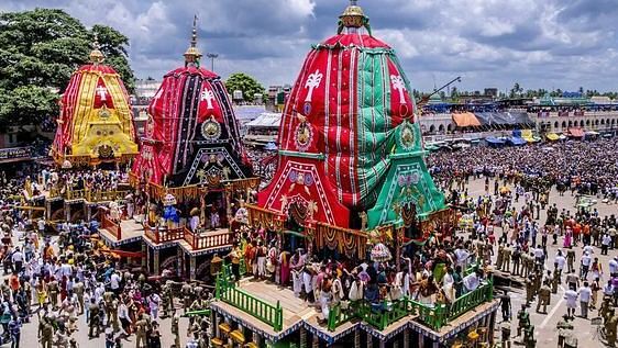 Rath yatra with a large group of people standing in front of a crowd