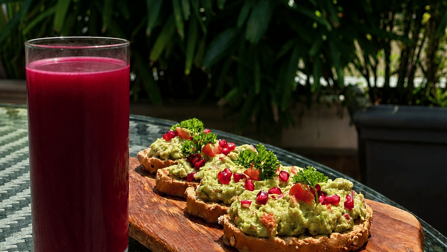 A healthy drink and snack placed on a table at Karma Lakelands.