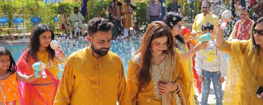 Advait & Akshay arriving in bright yellow attire for their haldi celebration at Umaid Palace.