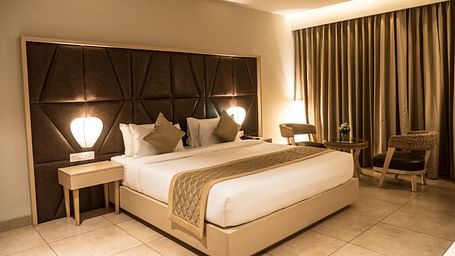 view of king size bed of Premium Room at Cholaa Dynasty, Kumbakonam