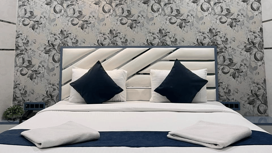 Premium double room with elegant interiors, comfortable bedding, and ambient lighting.