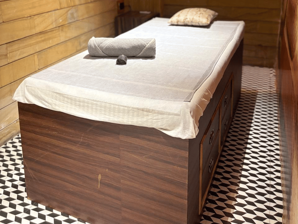 Skyline by Miraya, SKYN Spa, Treatment bed under warm wall light