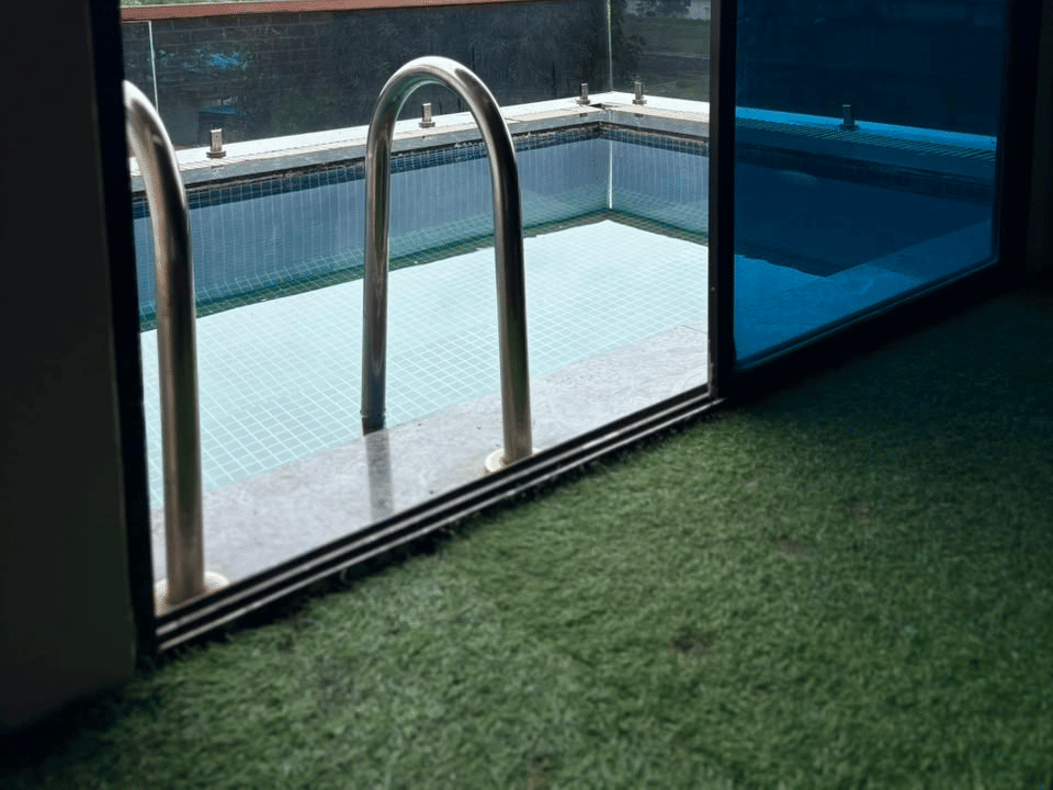Emperor Room, Grass-lined balcony deck at the pool edge