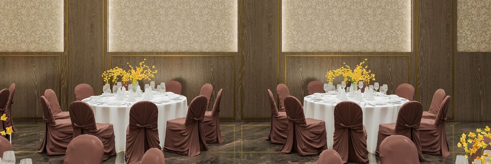 A meeting area with two round tables, chairs, and soft lighting at Town Square Suites.