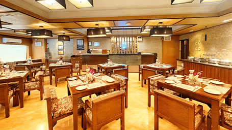 The dining area at Hi Brew Restaurant with tables arranged properly.