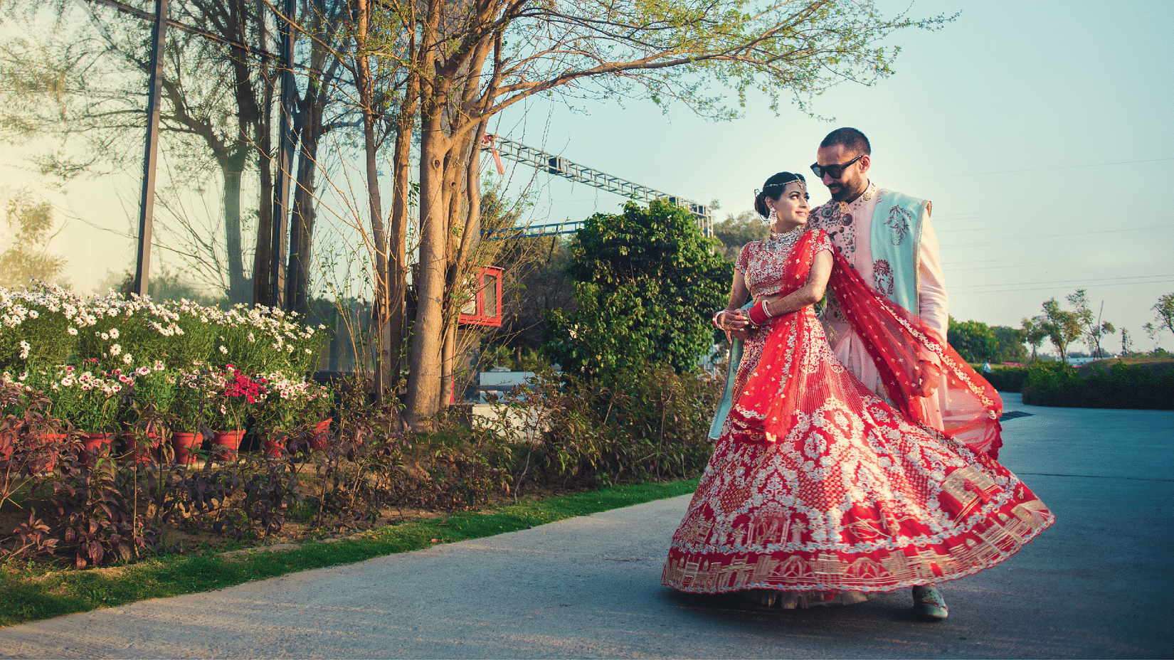 A bride and groom posing for a picture outdoors - Karma Lakelands.