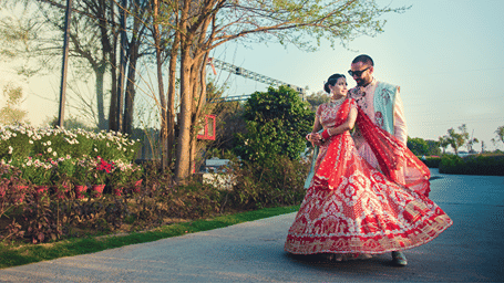 A bride and groom posing for a picture outdoors - Karma Lakelands.