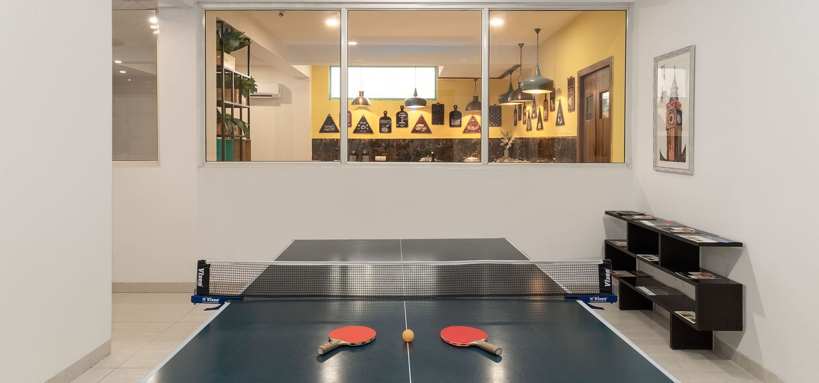 Table Tennis Court at Inde Hotel Cyber City  with tennis bats and a ball