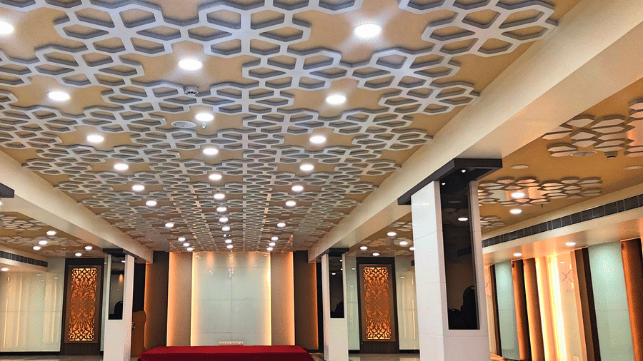 an empty Banquet Hall in Tirupati with many lights switched on - Raj Park Hotel, Tirupati