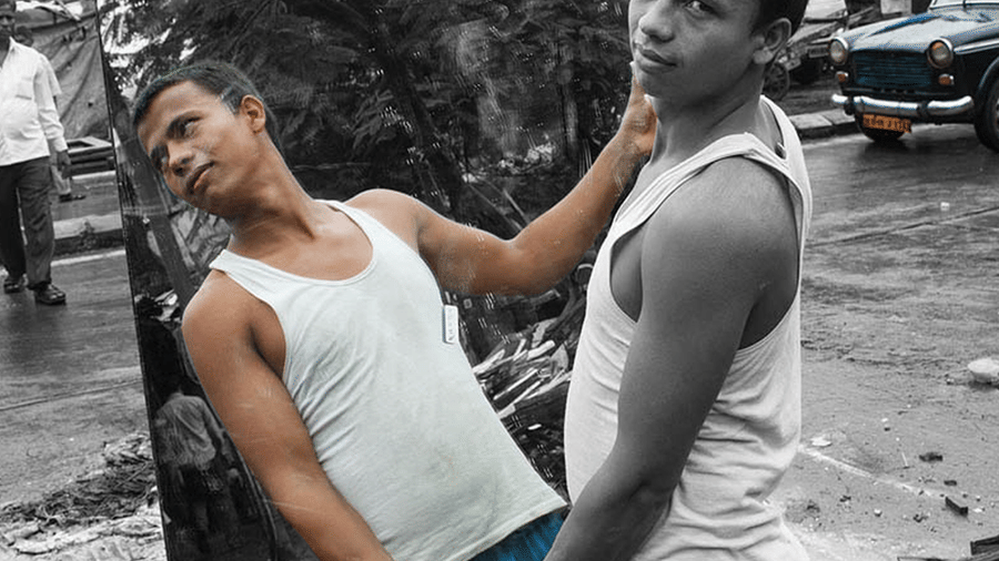 man carrying a mirror