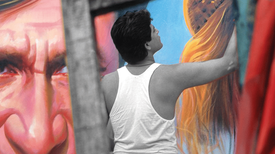 man painting on the wall