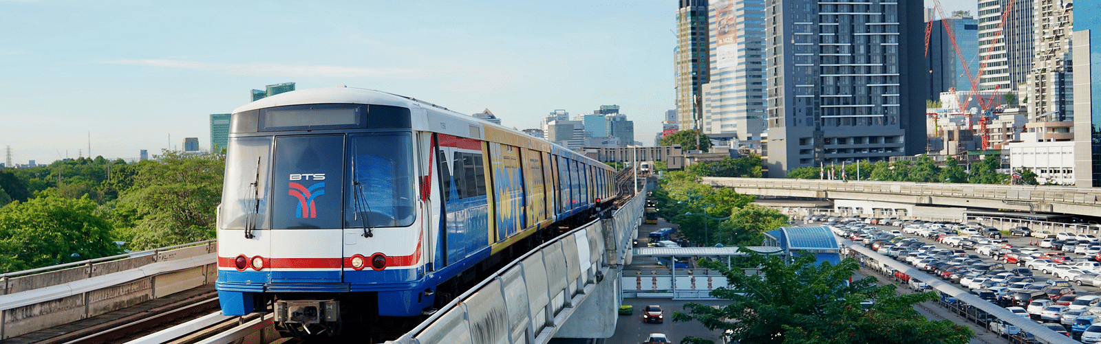 Front view of The BTS Skytrain during daytime with a train travelling.