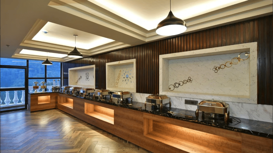 Claret Inn, Dalhousie - Buffet counter with food warmers, counter top space, and signage on the wall.