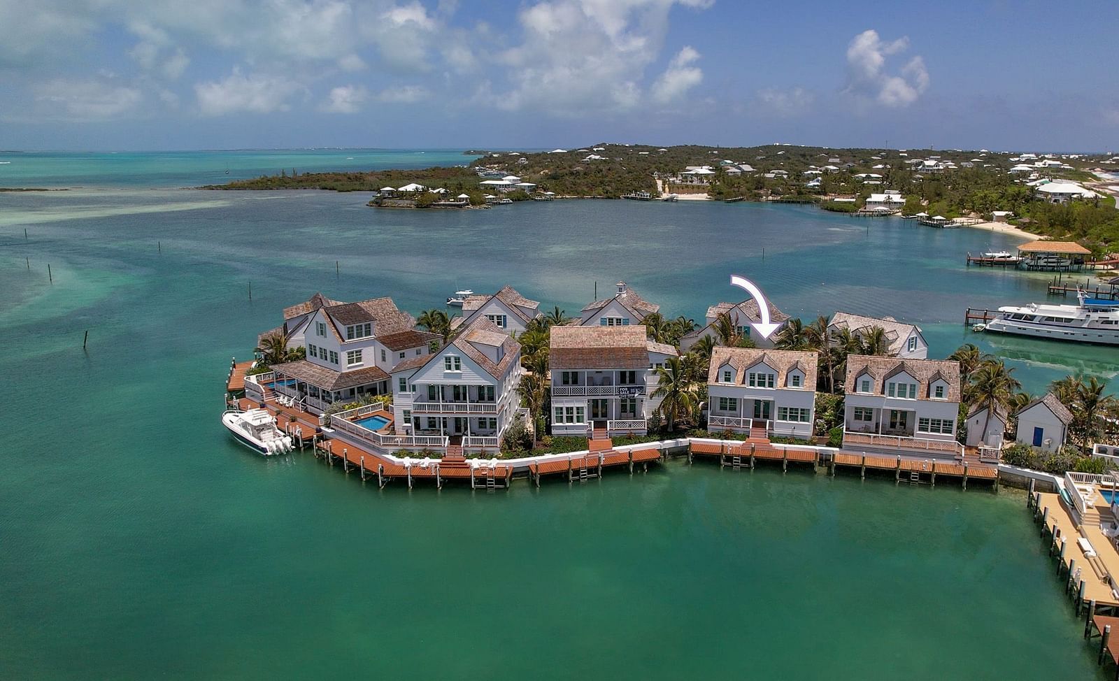 luxurious waterfront houses with private docs, and boats docked nearby at Abaco Inn.