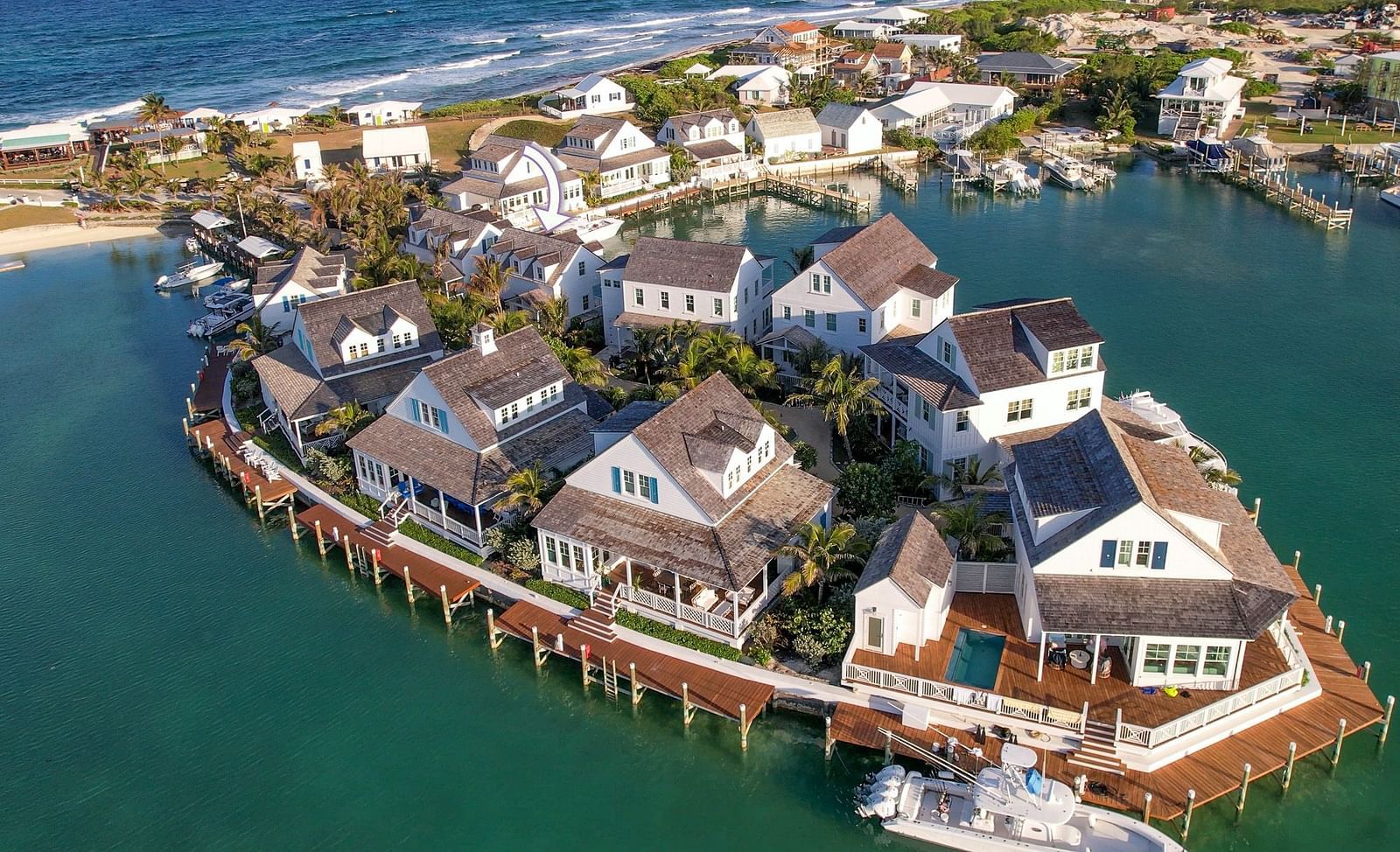 luxurious waterfront houses with private docs, and boats docked nearby at Abaco Inn.