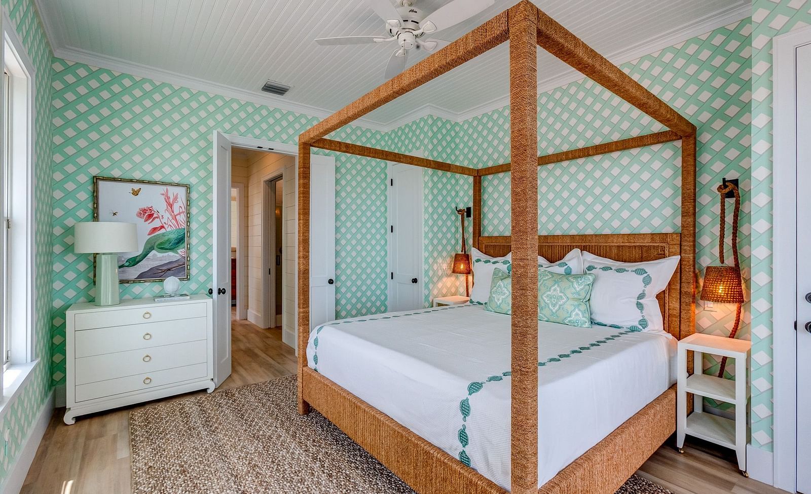 Bedroom with a wooden canopy bed and mint-green walls | Abaco Inn