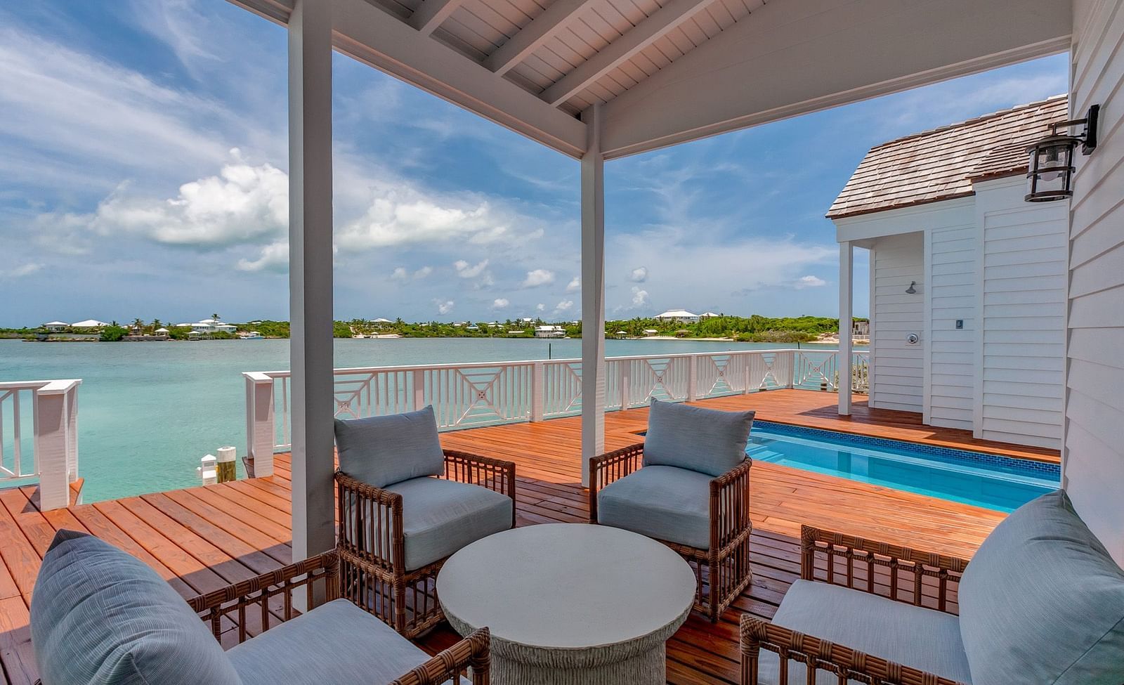 Private deck with outdoor seating, a pool, and ocean views | Abaco Inn