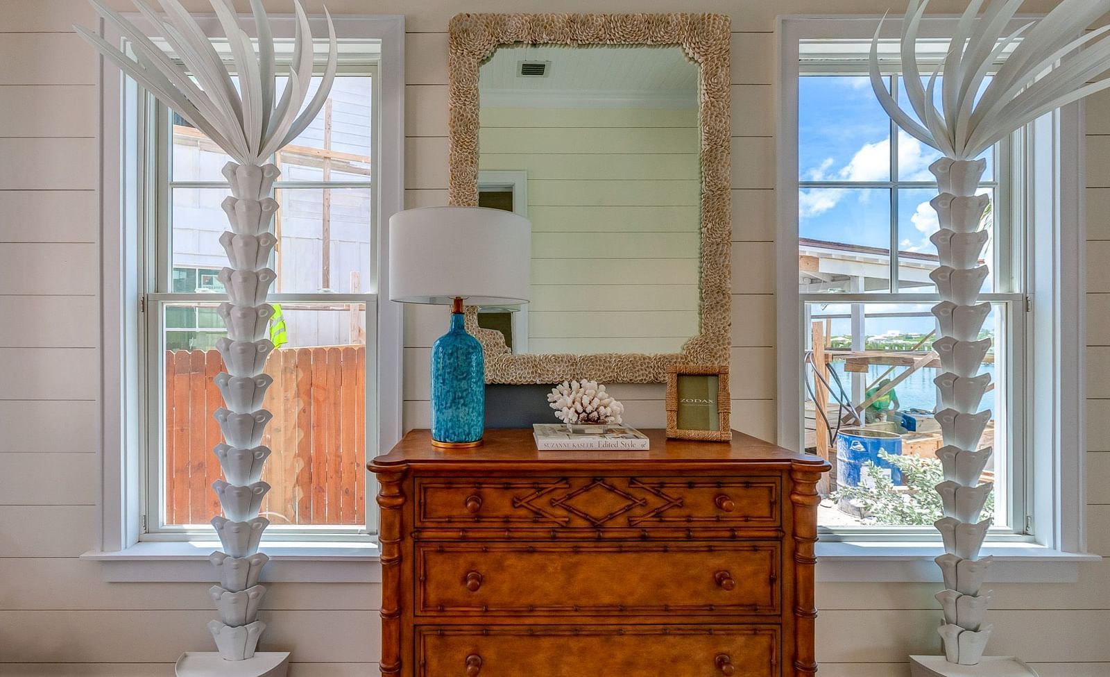 Reading nook with a wooden dresser and a large window | Abaco Inn