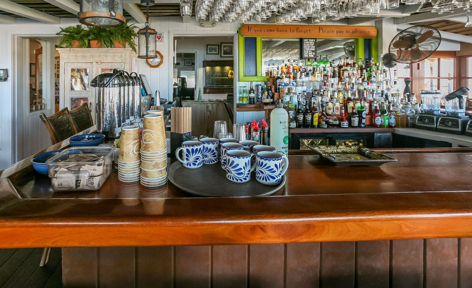 Bar counter with drinks and glassware | Abaco Inn