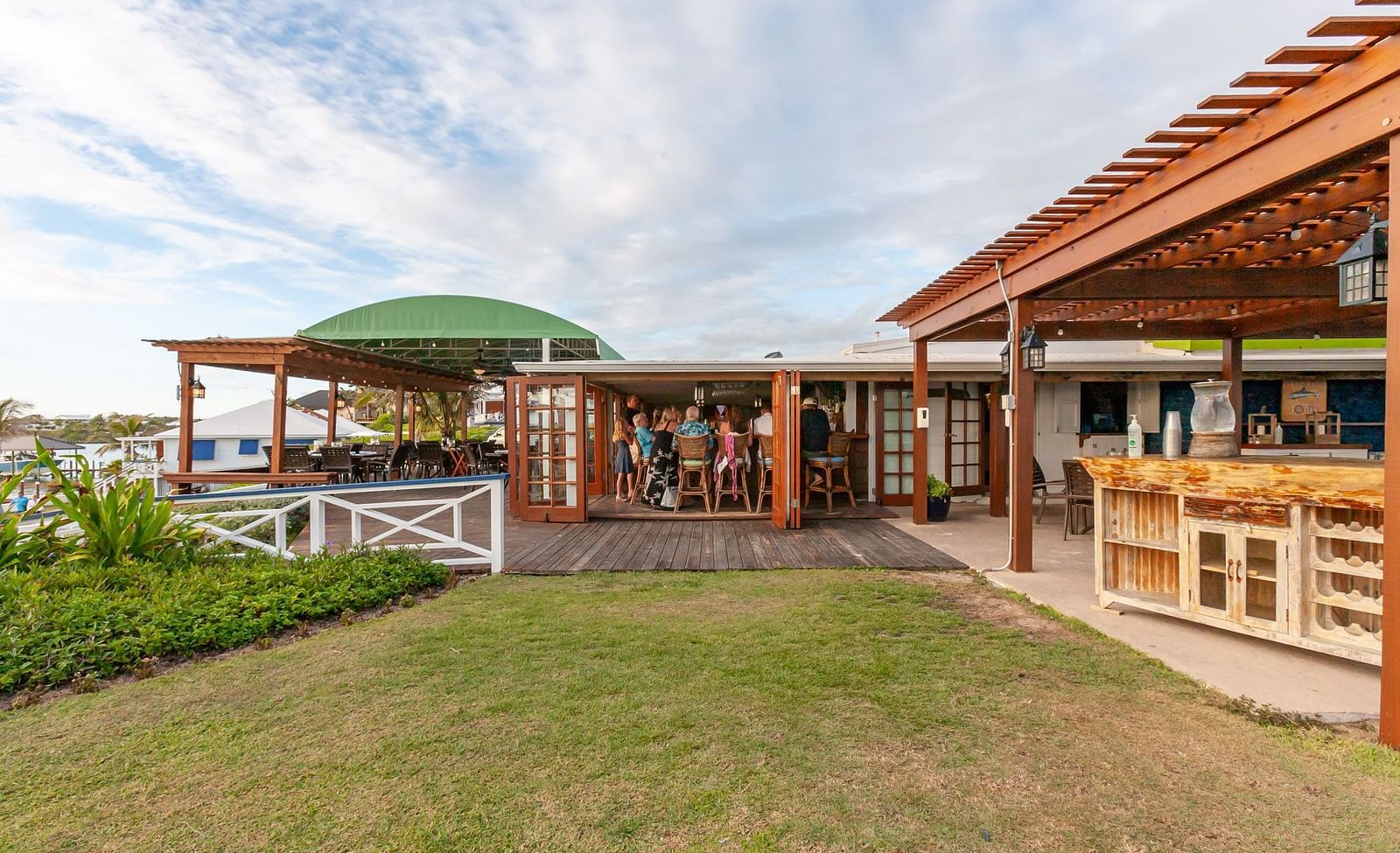 Restaurant with wooden roof and garden by the beach | Abaco Inn