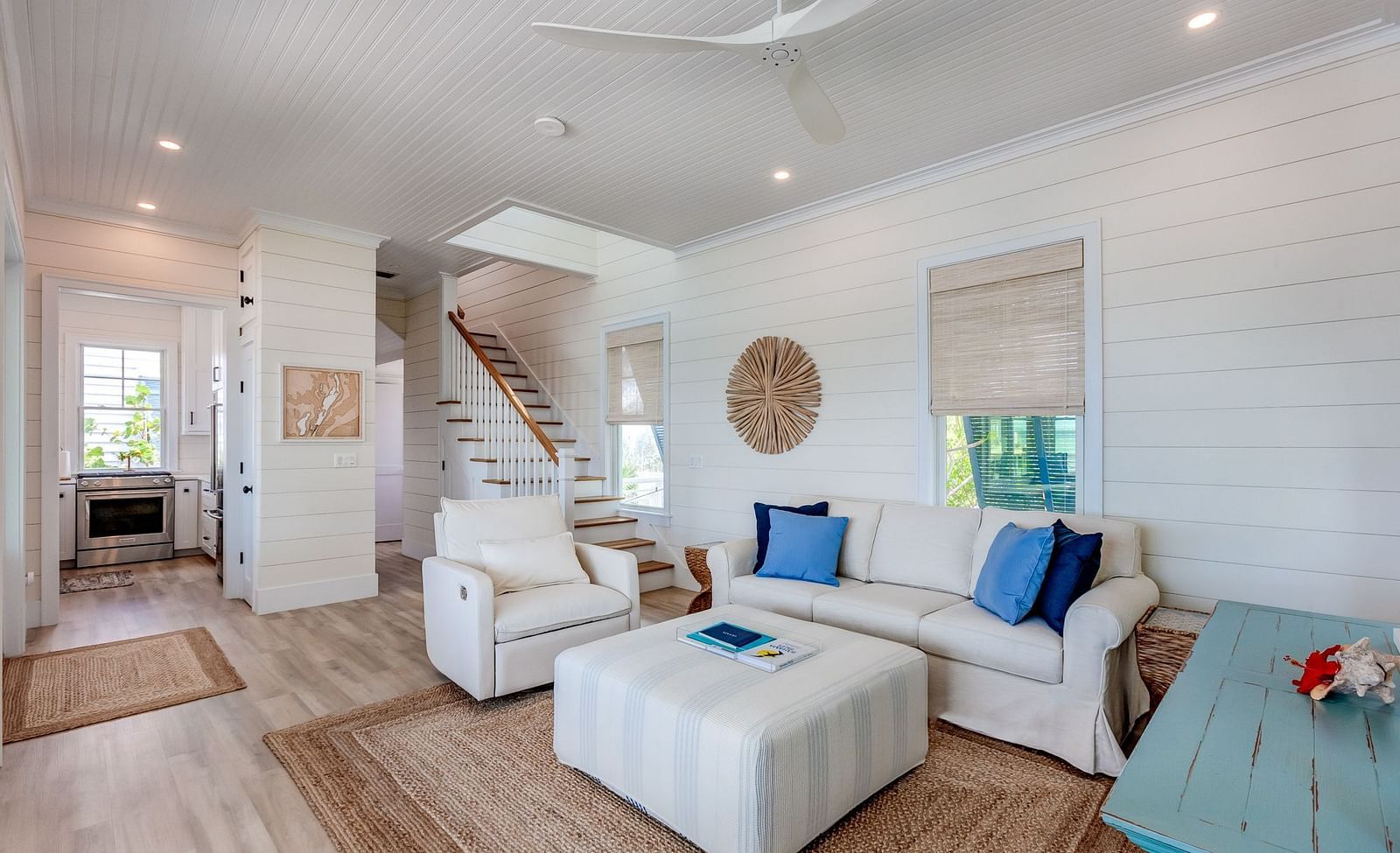 Spacious living area with white sofas and coastal decor | Abaco Inn