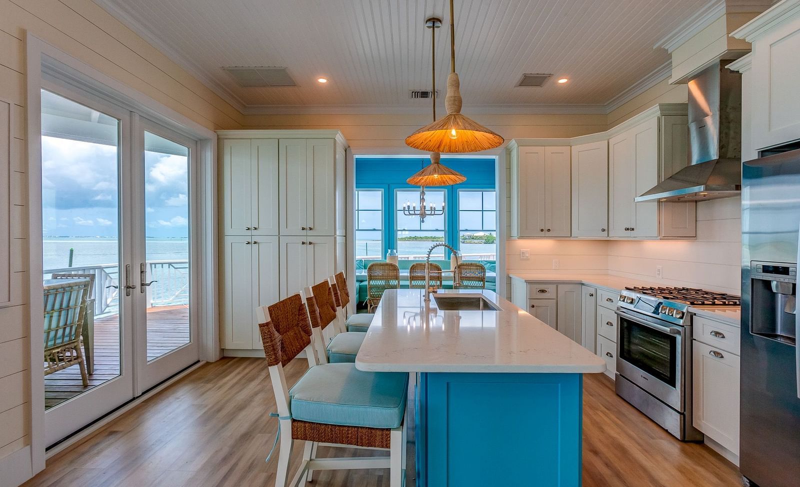 Open kitchen and dining area with ocean views and wooden accents | Abaco Inn