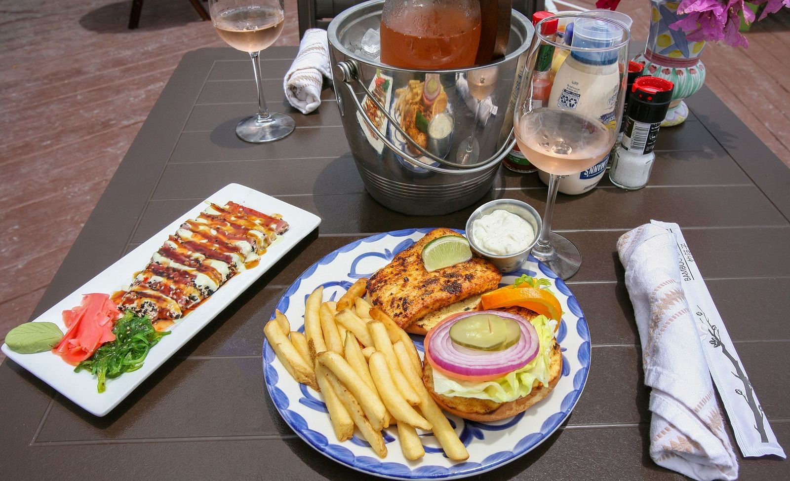 Lunch plate with fries, burger, and salad on a restaurant table | Abaco Inn