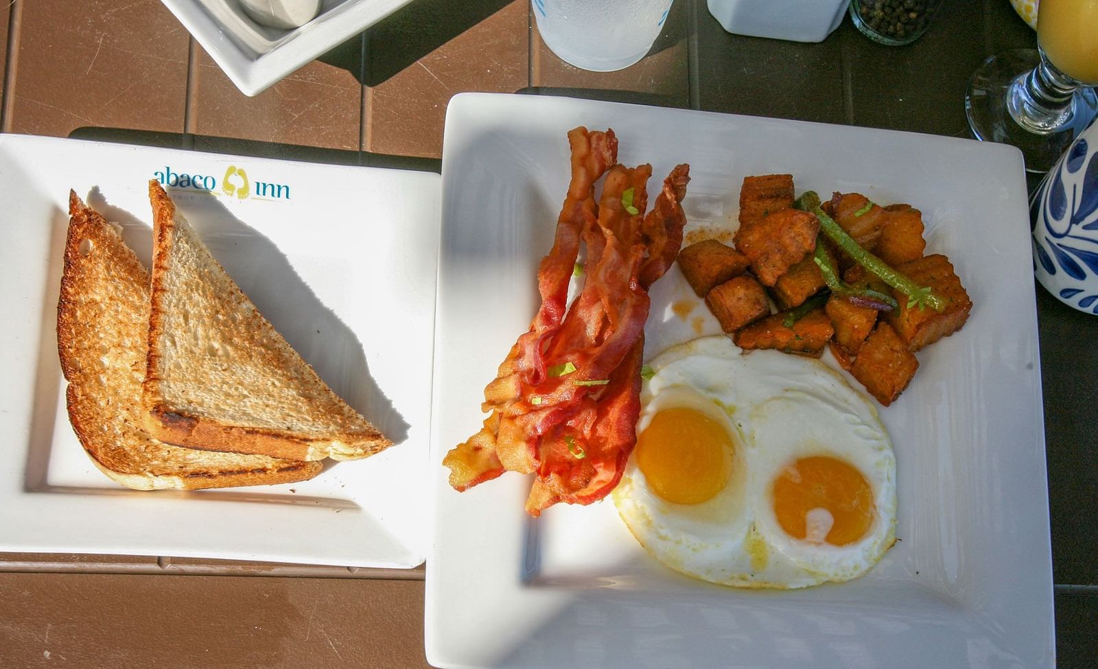 Close-up of toast, egg, shrimp, and sweet potato plate | Abaco Inn
