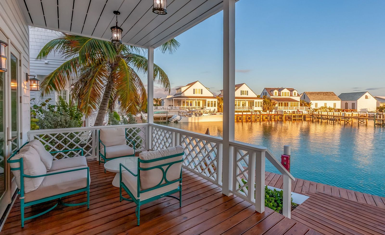 a sitting area with chairs and wooden floor featuring the sea view at Abaco Inn.
