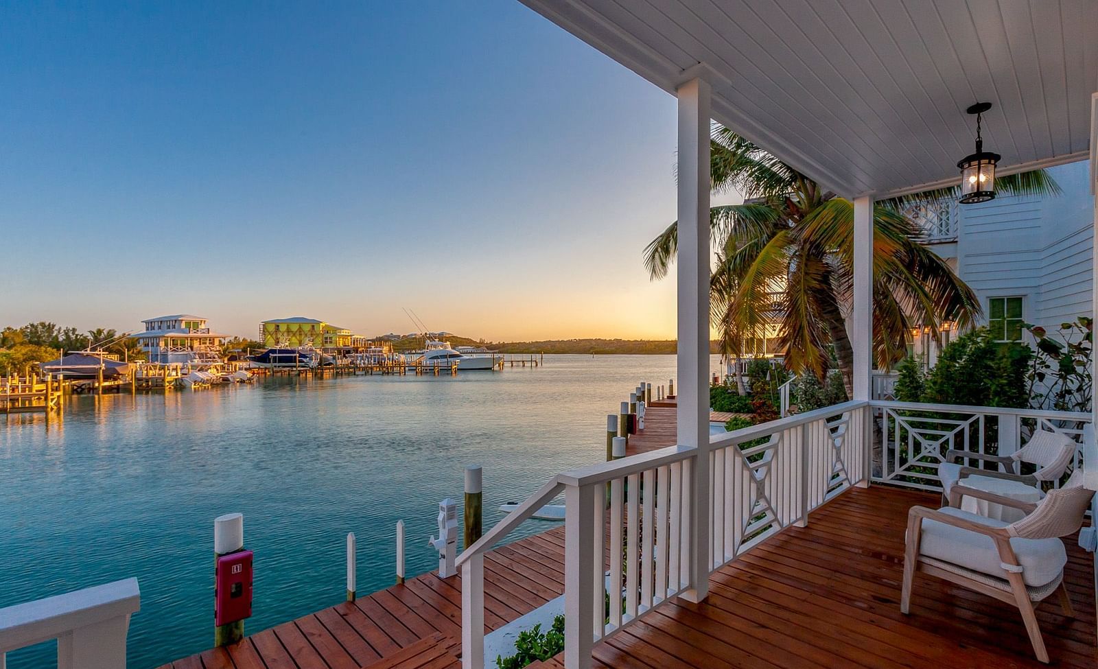 comfortable chairs on the wooden dock with the sea view at Abaco Inn.
