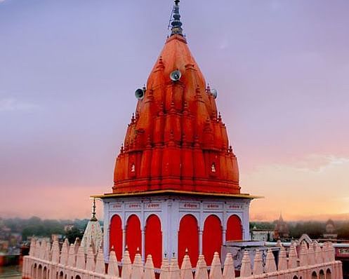 A hindu temple with a saffron dome