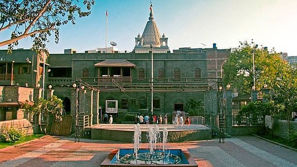 fountain in front of a stately building