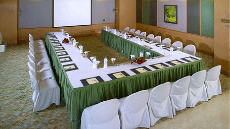 Food seating arrangement with chairs and table at Grand Chennai By GRT Hotels.