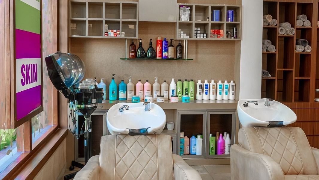 Image of two chairs kept at IOSIS Spa & Wellness Raipur with other salon equipments