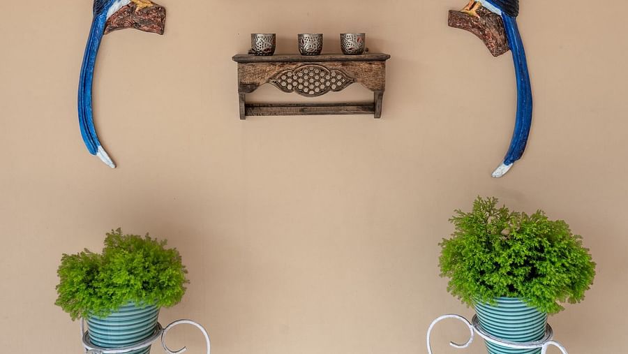 Two bird figurines on the wall at the hotel entrance at The Pavilion, Nainital