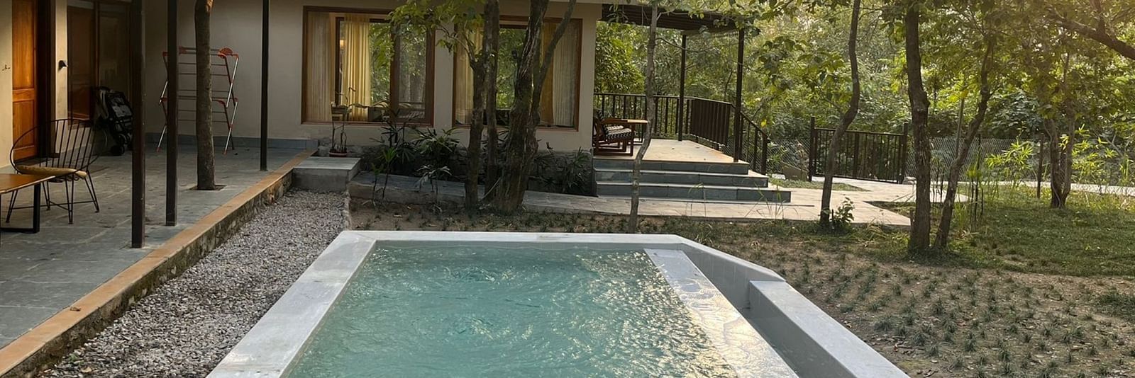 Sanctuary Suite at Saraca Resort & Spa Corbett with an outdoor plunge pool surrounded by paved stones and gardens