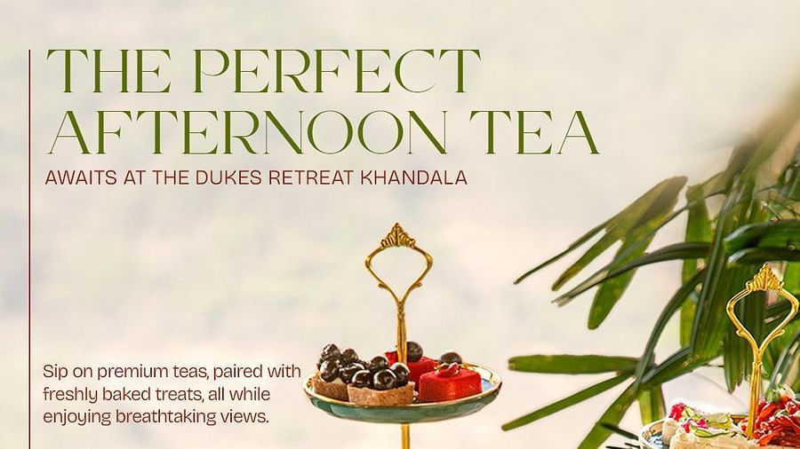 Afternoon tea setup with elegant teapots, cups, and a three-tier stand filled with colorful macarons, pastries, and savory treats at The Dukes Retreat Khandala