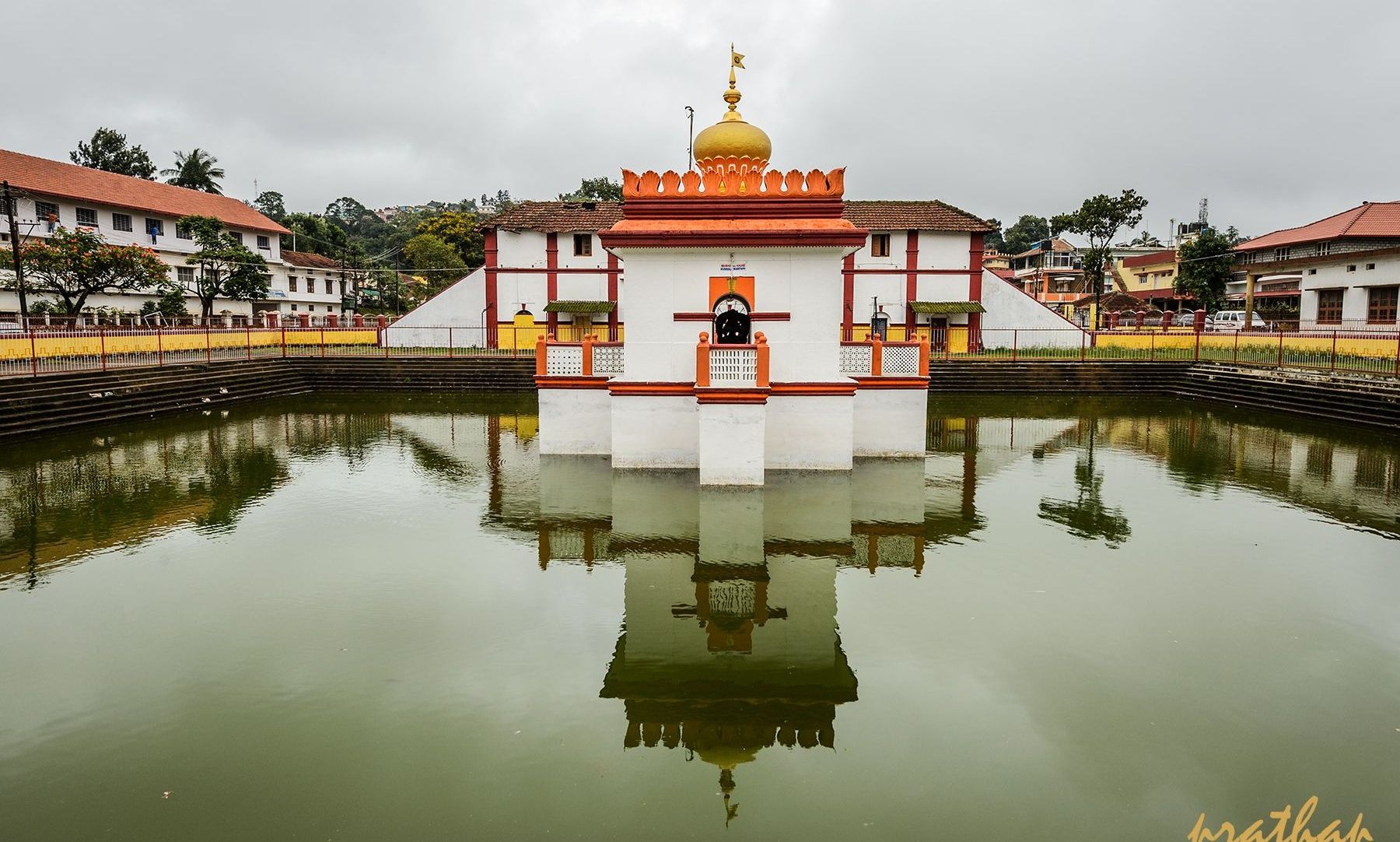 Omkareshwara Temple reflected in its sacred water tank.