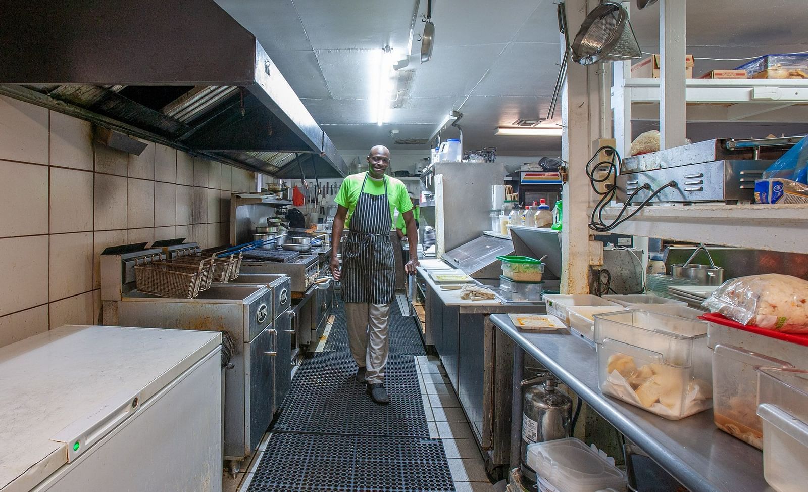 Commercial kitchen with chefs preparing food | Abaco Inn