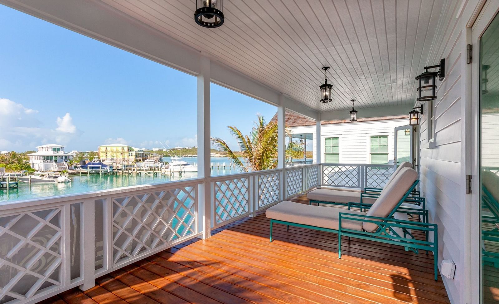 comfortable chairs on the wooden dock with the sea view at Abaco Inn.