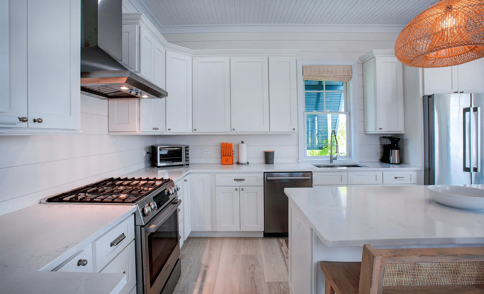 Kitchen with stainless steel appliances and a wooden dining table | Abaco Inn